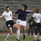 Aileen Loera keeps up the fight against Redwood Tuesday night.